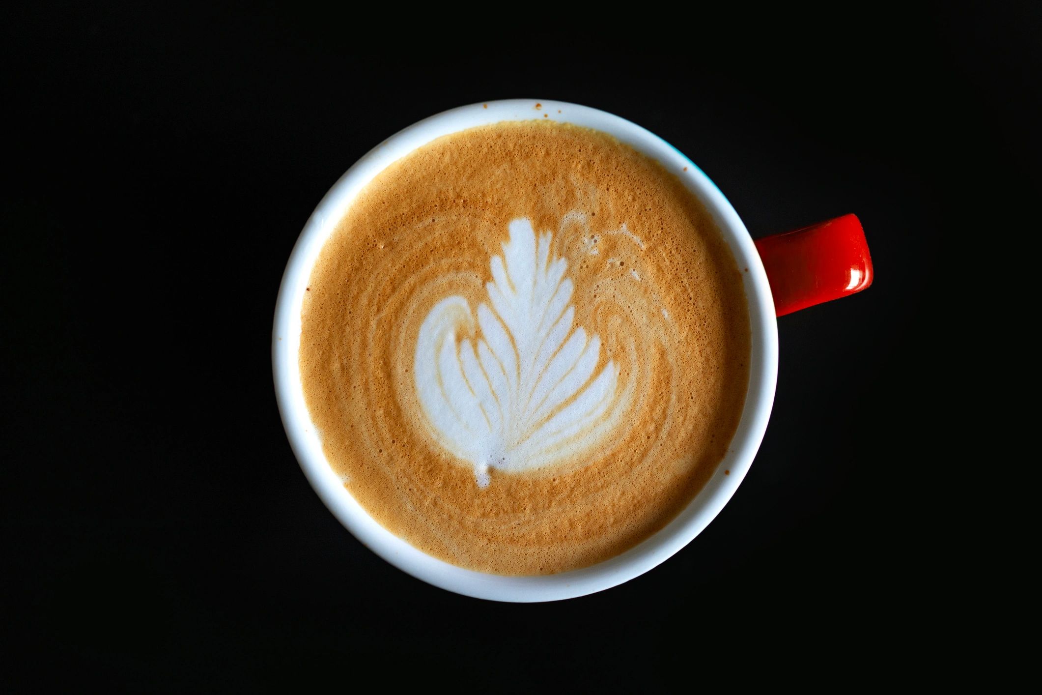 Latte art coffee in a ceramic cup